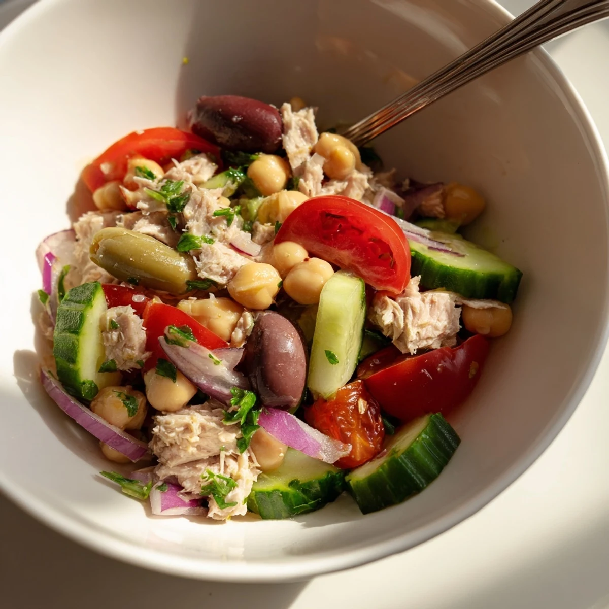 Golden tuna and creamy garbanzo bean salad tossed with crisp vegetables in zesty lemon-herb dressing