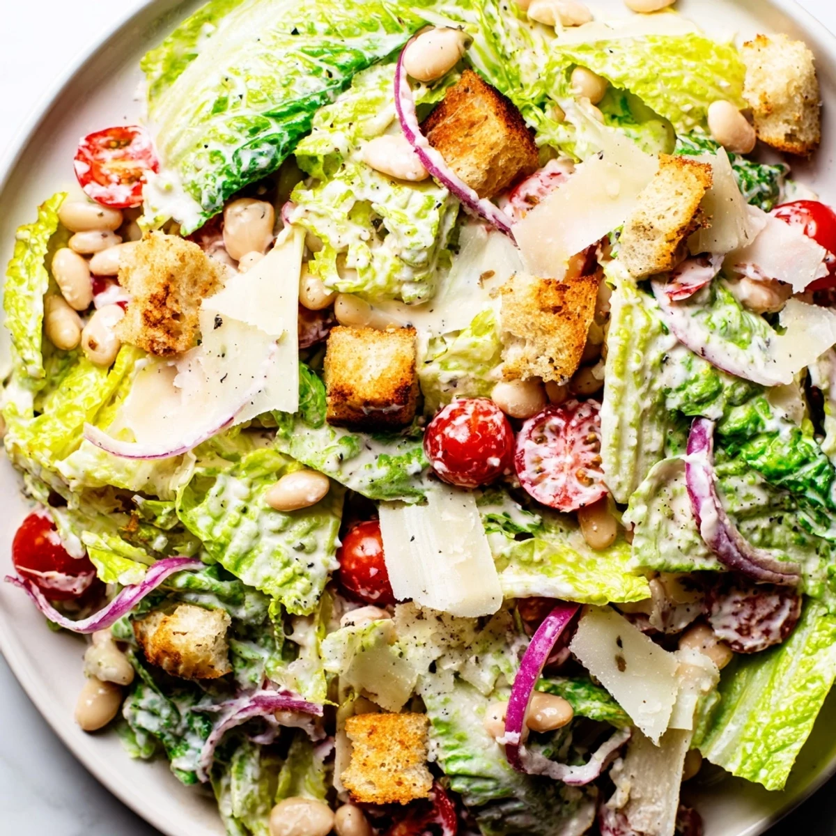 Protein-packed butter bean Caesar salad featuring crisp romaine lettuce and tangy Caesar dressing
