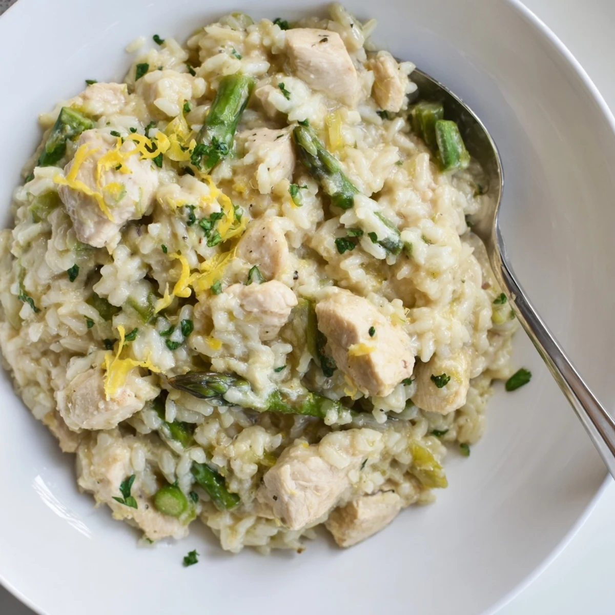 Golden diced chicken pieces mixed with tender asparagus spears in rich Arborio rice.