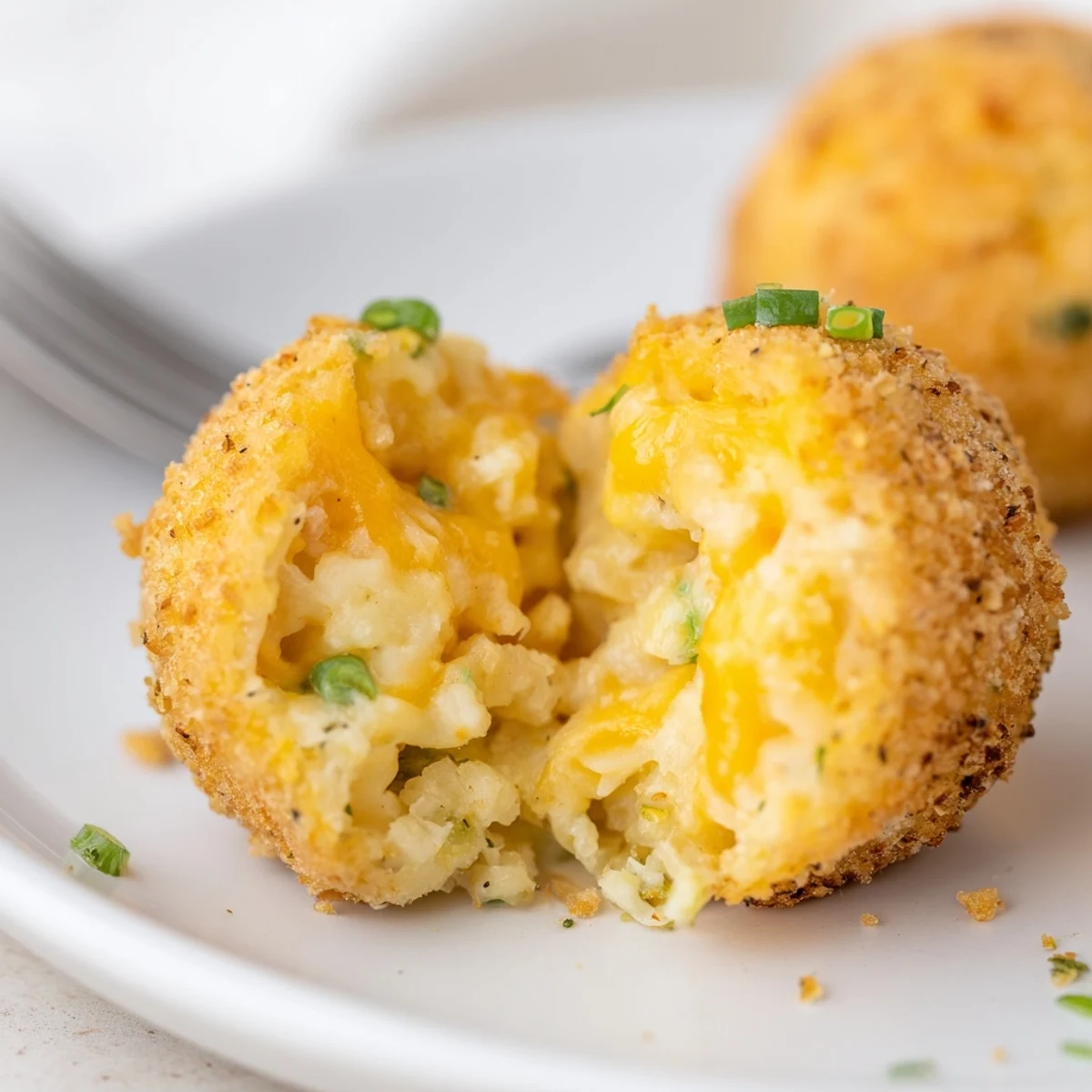 Tray of Fried Mashed Potato Balls cooling after frying, panko crunch, scallions