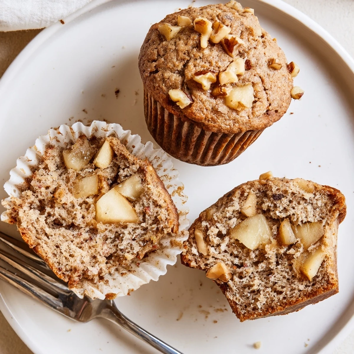 Healthy Apple Cinnamon Greek Yogurt Muffins cut open, moist crumb, honey drizzle
