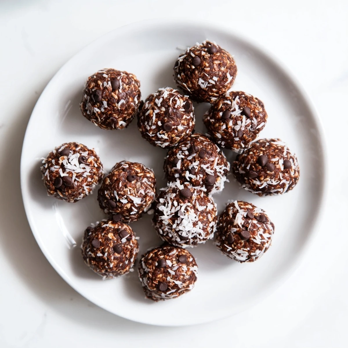 Rich chocolate no bake brownie bites arranged on a serving platter for easy party snacking.