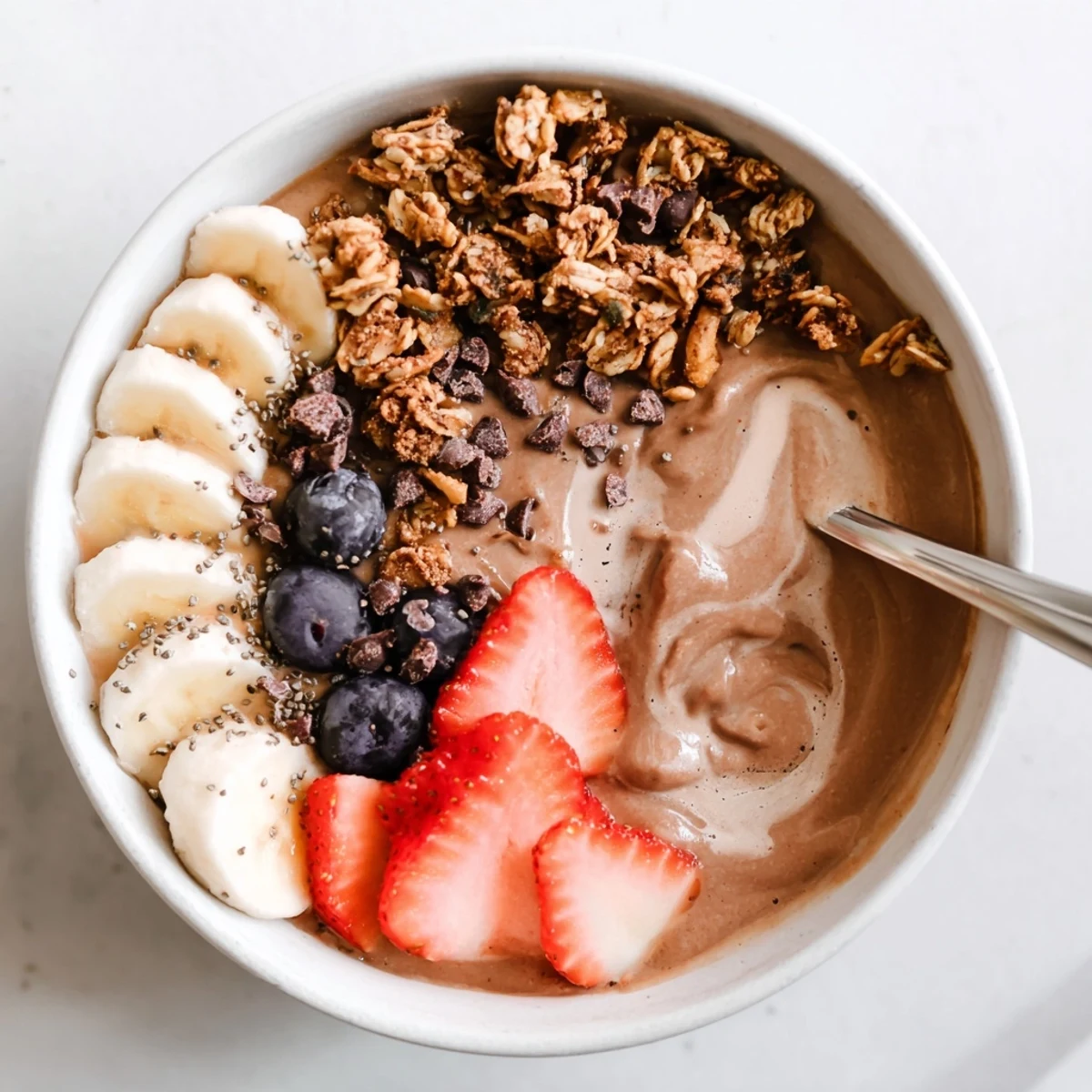 Chilled Coffee Protein Smoothie Bowl garnished with fresh berries and chia seeds