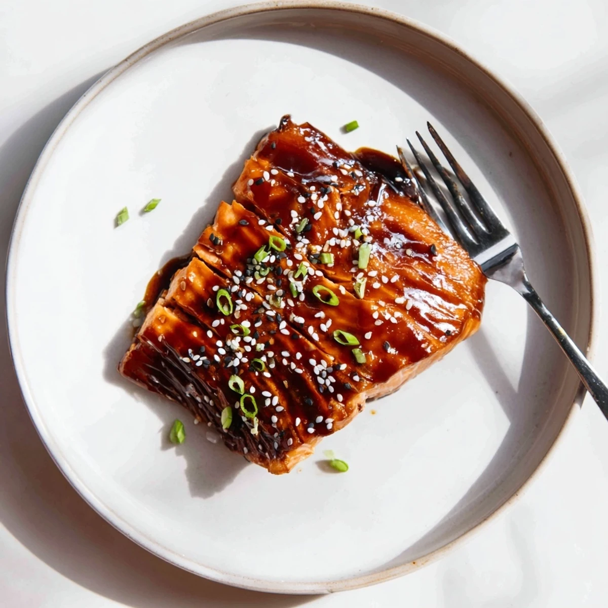 Gluten Free Teriyaki Salmon Recipe: oven-roasted fillet, glossy glaze and sesame seeds